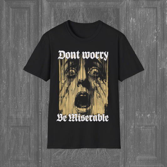 Yellow print of a terrified man’s face with the text 'Don’t Worry, Be Miserable' on a black scary tee