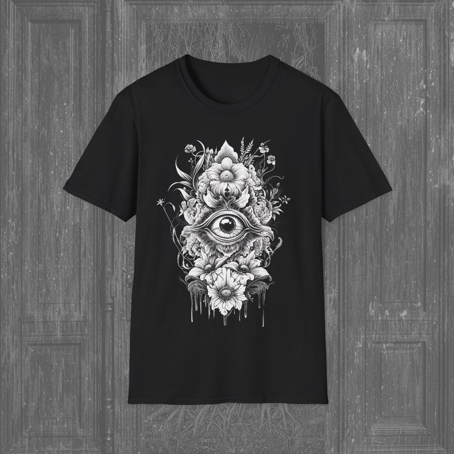 Graphic of a symmetrical flower design with an eye at the center on a black t-shirt.