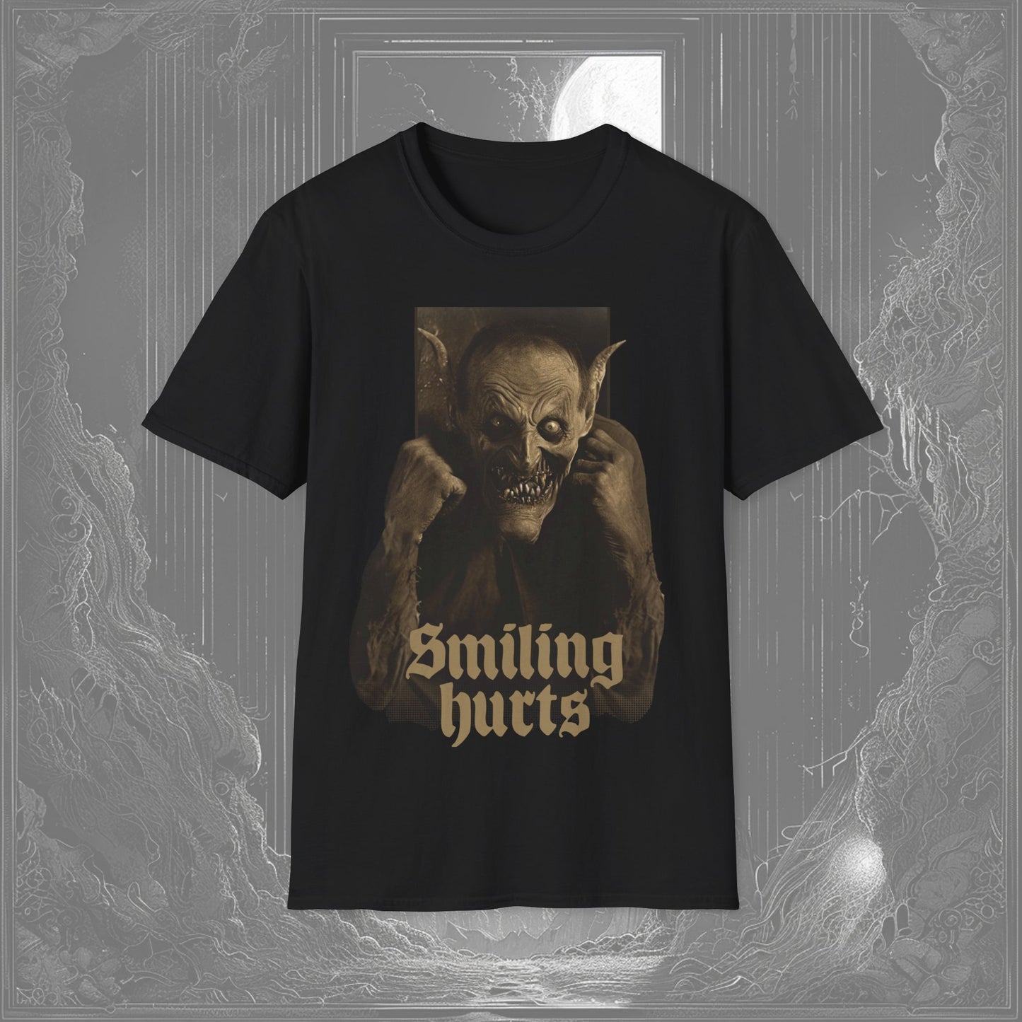 Black t-shirt with a grotesque demon grinning menacingly, jagged teeth exposed, and the phrase 'Smiling Hurts' beneath—a perfect scary graphic t-shirt.